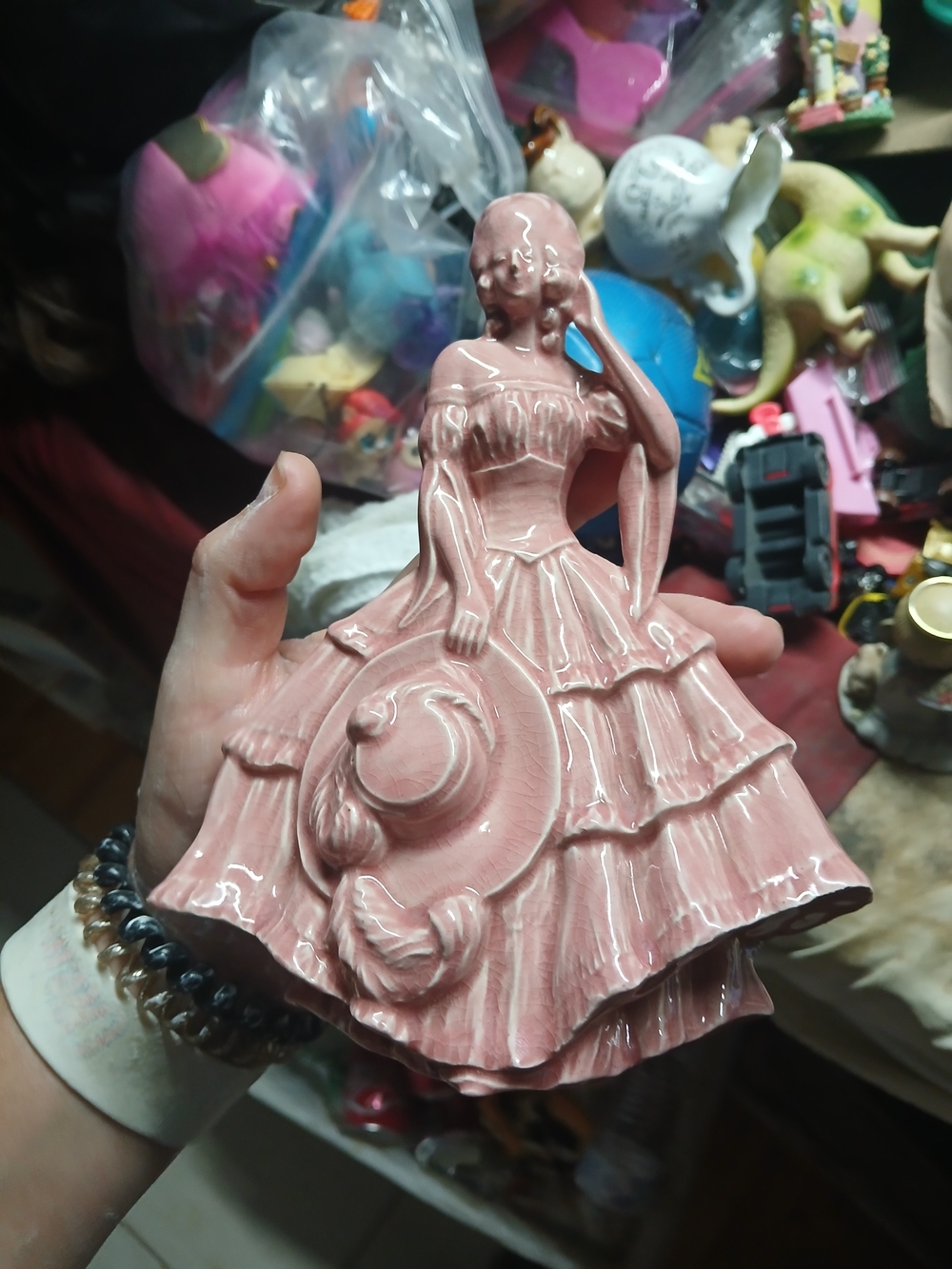 porcelain figurine of a Southern Belle or crinoline lady wearing a multi-tiered